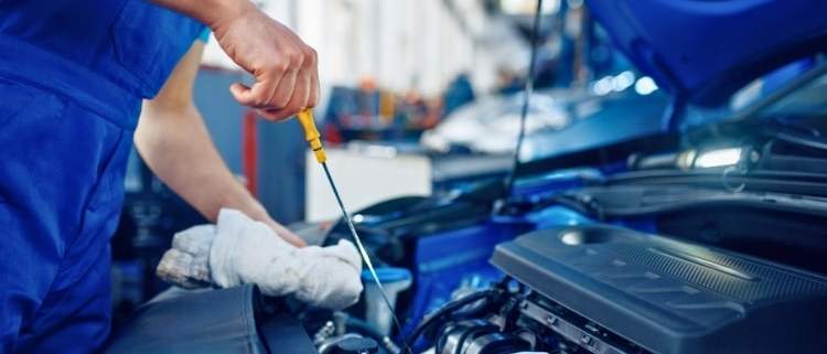 A car receiving comprehensive maintenance in a garage.