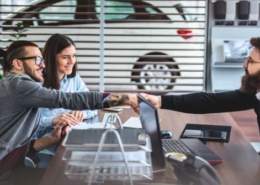 Self-employed individual reviewing car financing options at a dealership