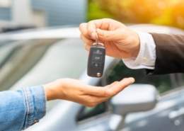 A person completing a lease buyout for their car.